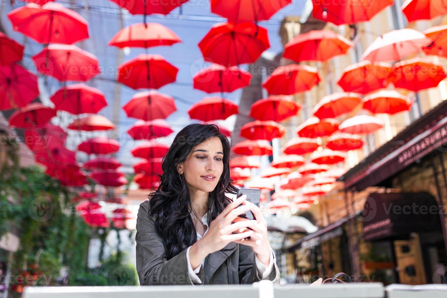 Beautiful young woman with cup of coffee. Woman enjoys fresh coffee in the morning with sunrise at coffe shop Beautiful woman drinking coffee in the morning sitting outdoors photo