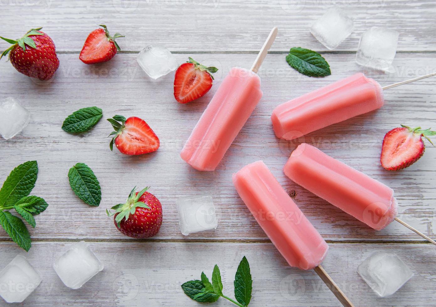 Strawberry ice cream popsicles photo