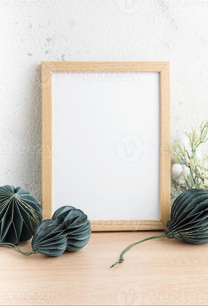 White blank wooden frame mockup with Christmas decorations photo
