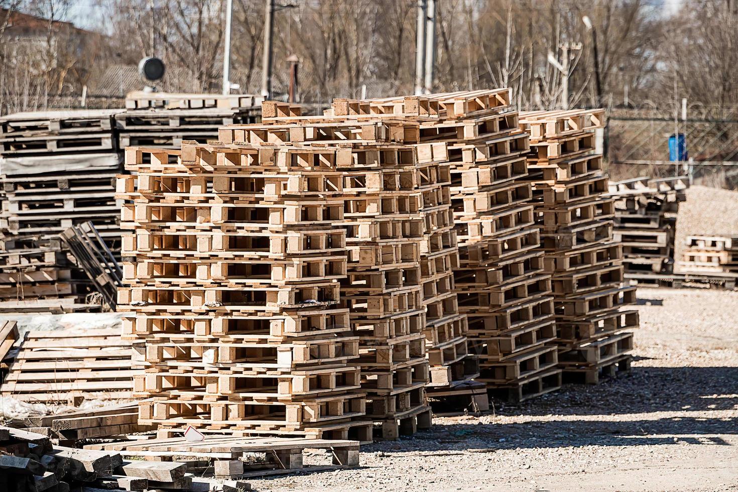 Stack of wooden pallets in warehouse. Industrial logistics and t photo