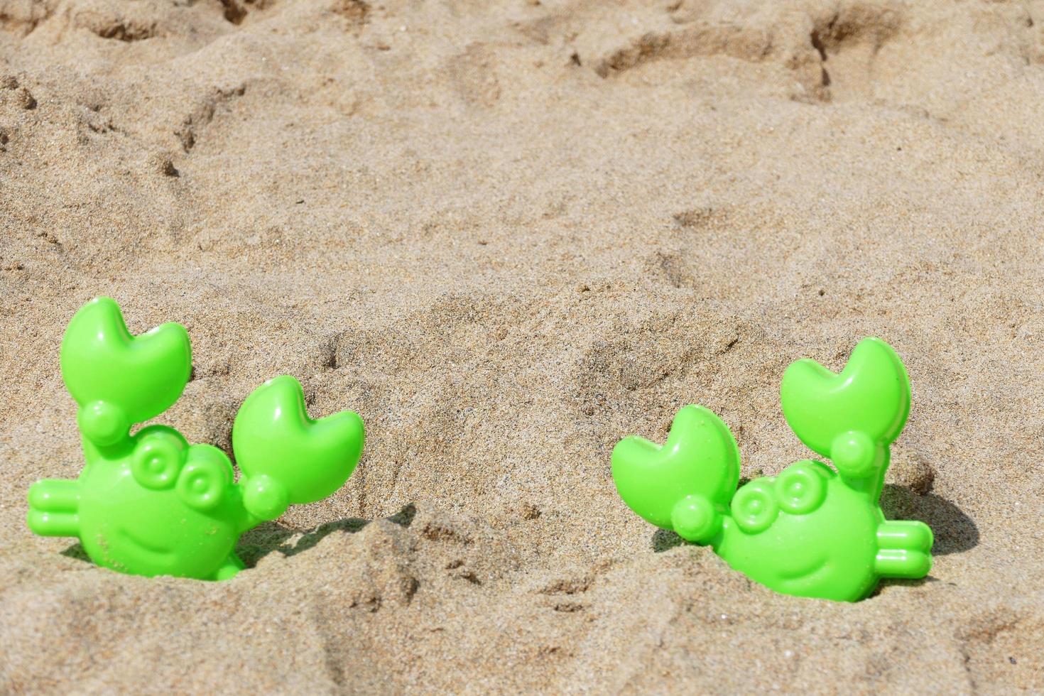 Toy Crabs In The Sand photo