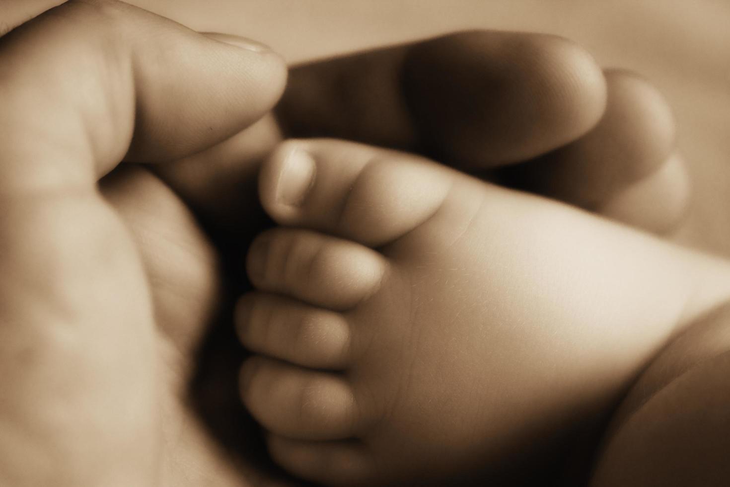 Cute Baby Foot Sepia Toned photo