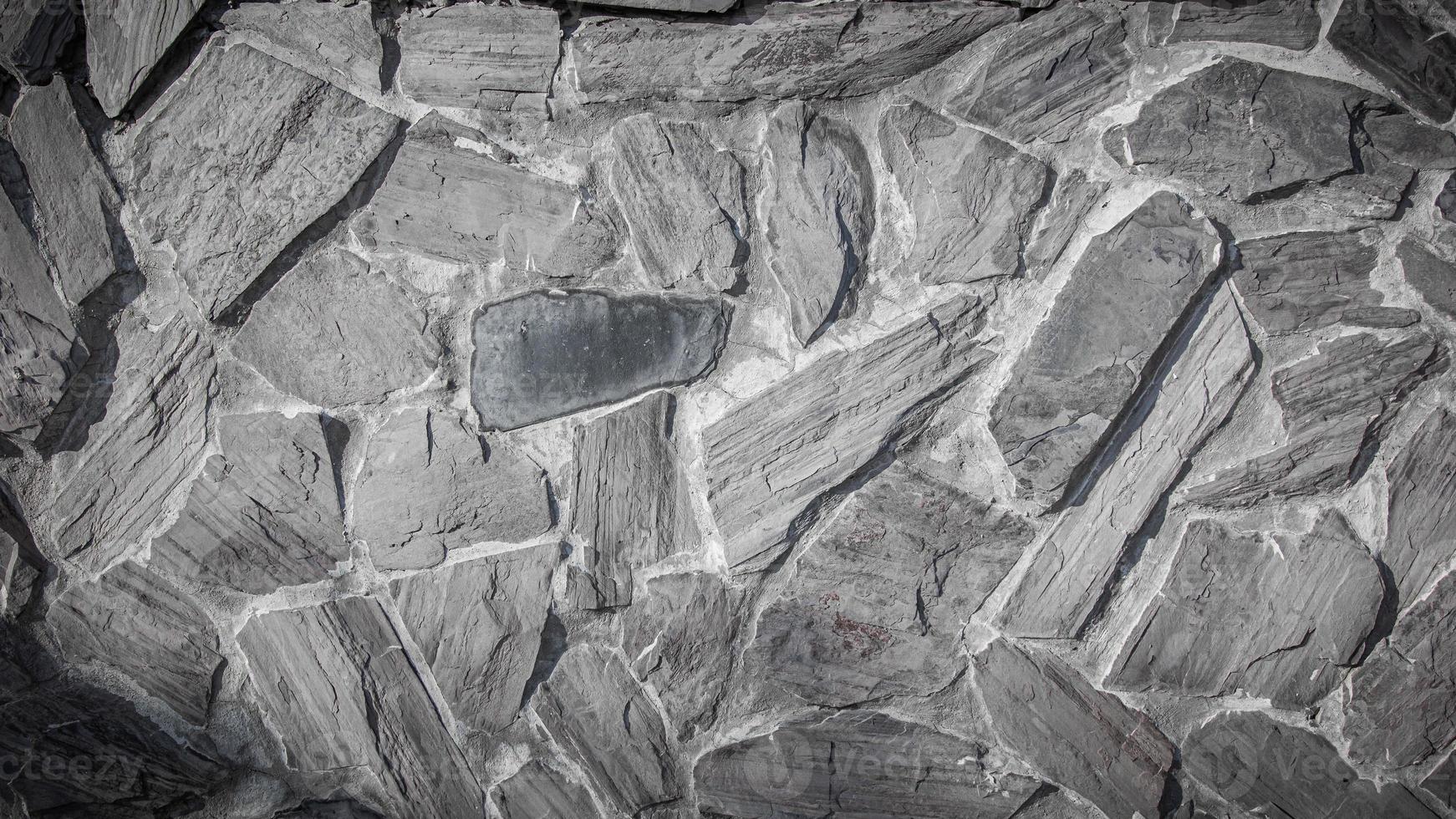 The texture of the stone wall.white gray grunge background with copy space for design. photo