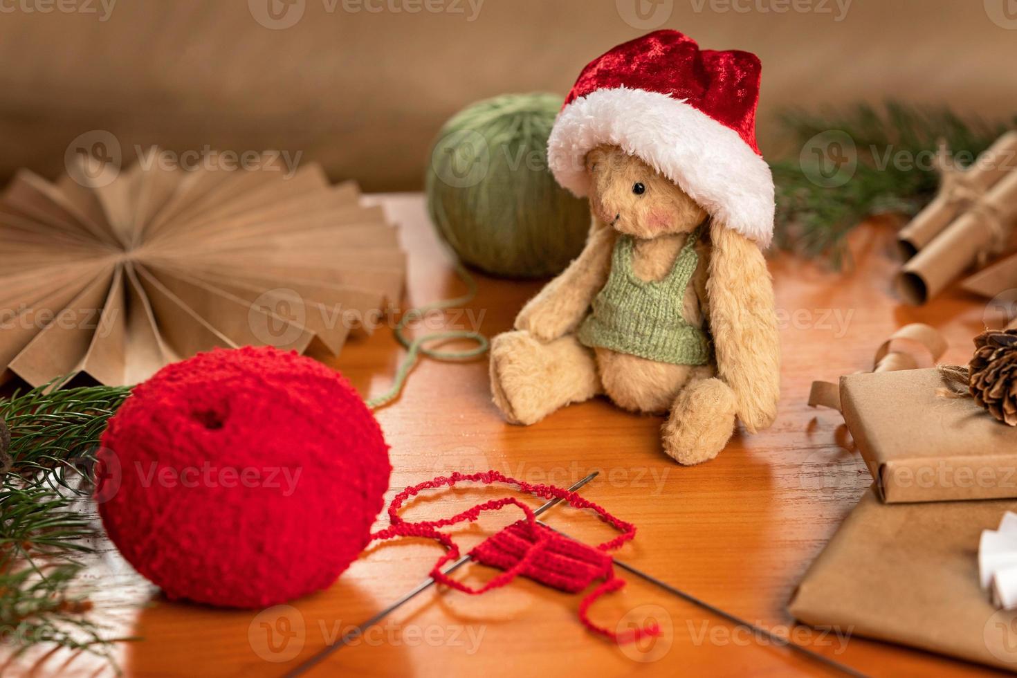 Handmade toy and clothes for it. Flat lay made of toys made by your own for Christmas photo