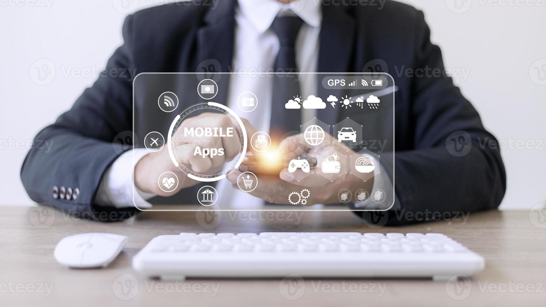 mobile apps concept.Business man hands holding touch screen smartphone outside in the park,color filter,all element graphic are made up by me photo