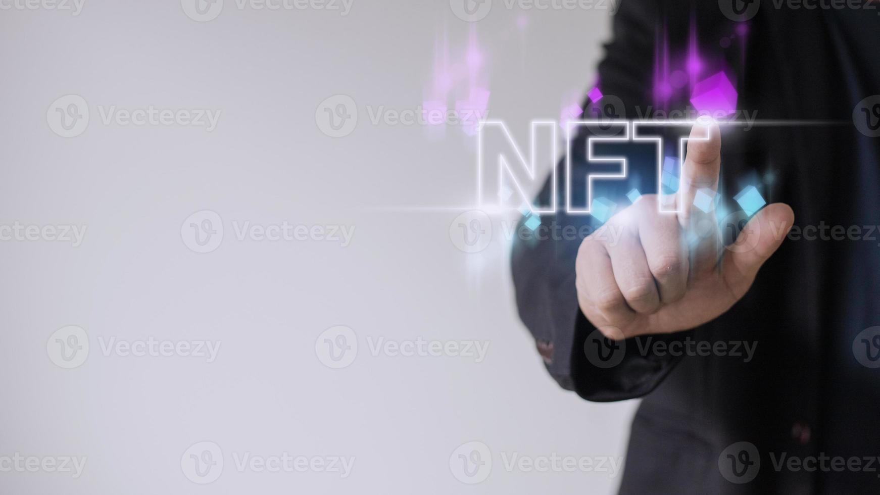 businessman finger touch virtual screen, NFT token digital crypto art blockchain technology concept photo