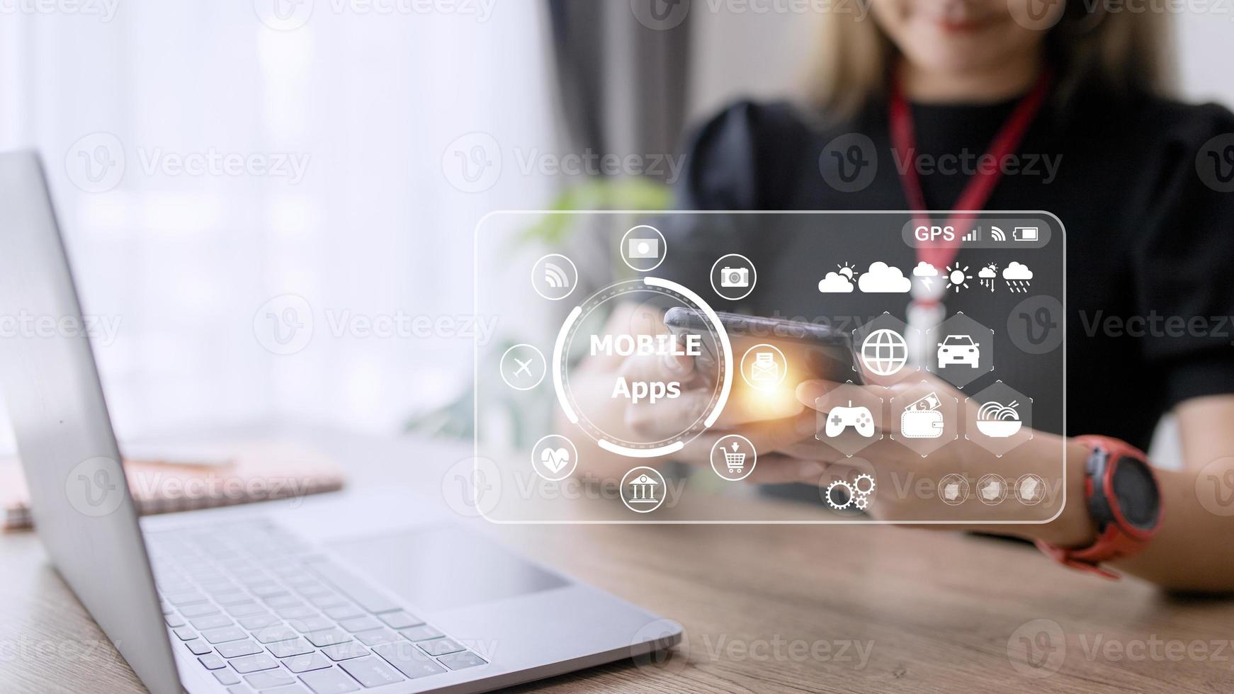 mobile apps concept.Business woman hands holding touch screen smartphone outside in the park,color filter,all element graphic are made up by me photo