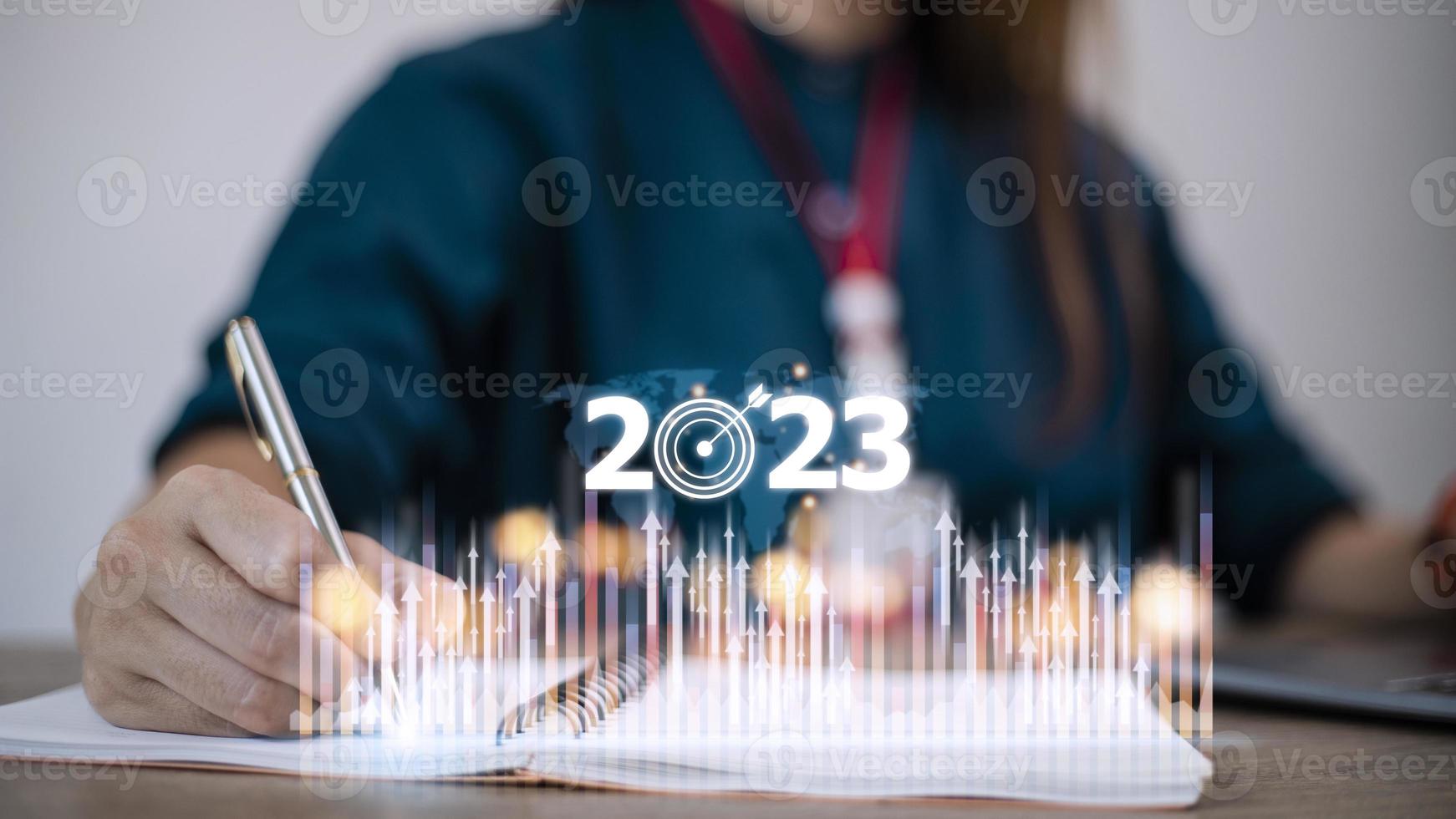 Business and Technology target set goals and achievement in 2023 new year resolution statistics graph rising revenue, planning to start up strategy, icon concept photo