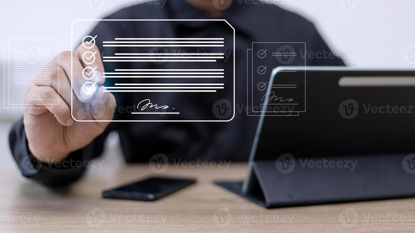 Electronic signature concept, business people sign electronic documents on digital documents, paperless office, future business contract signing. photo