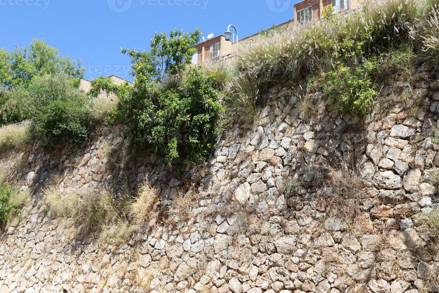 High wall made of stone and concrete. photo