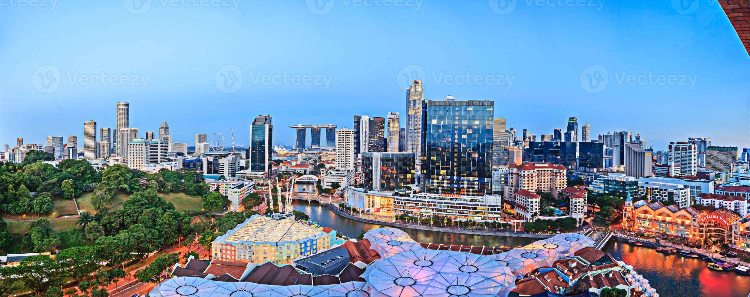 Aerial panoramic picture of the Singapore skyline during evening twilight in summer photo