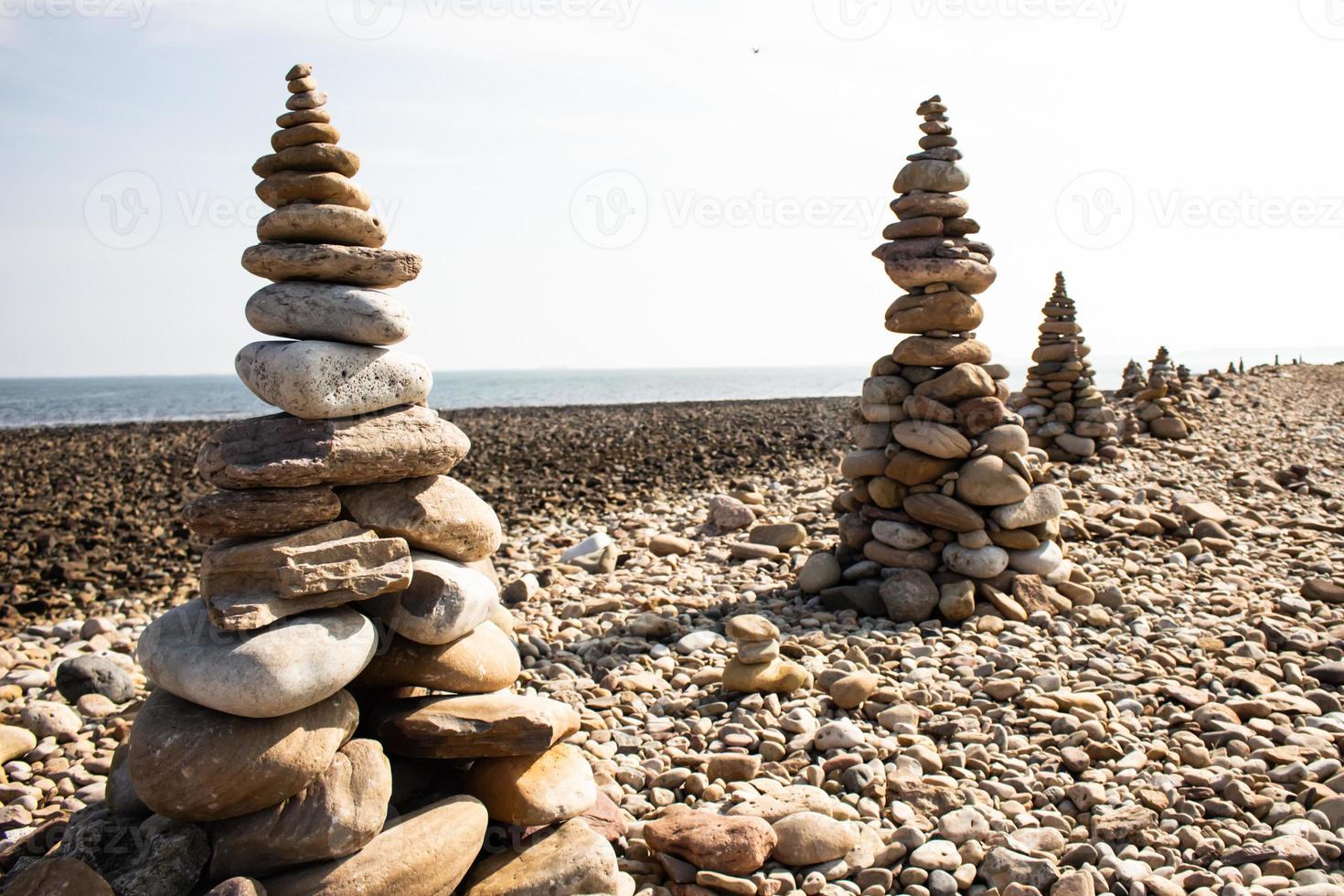 Pebble stack on the beach at Lindisfarne holy island photo