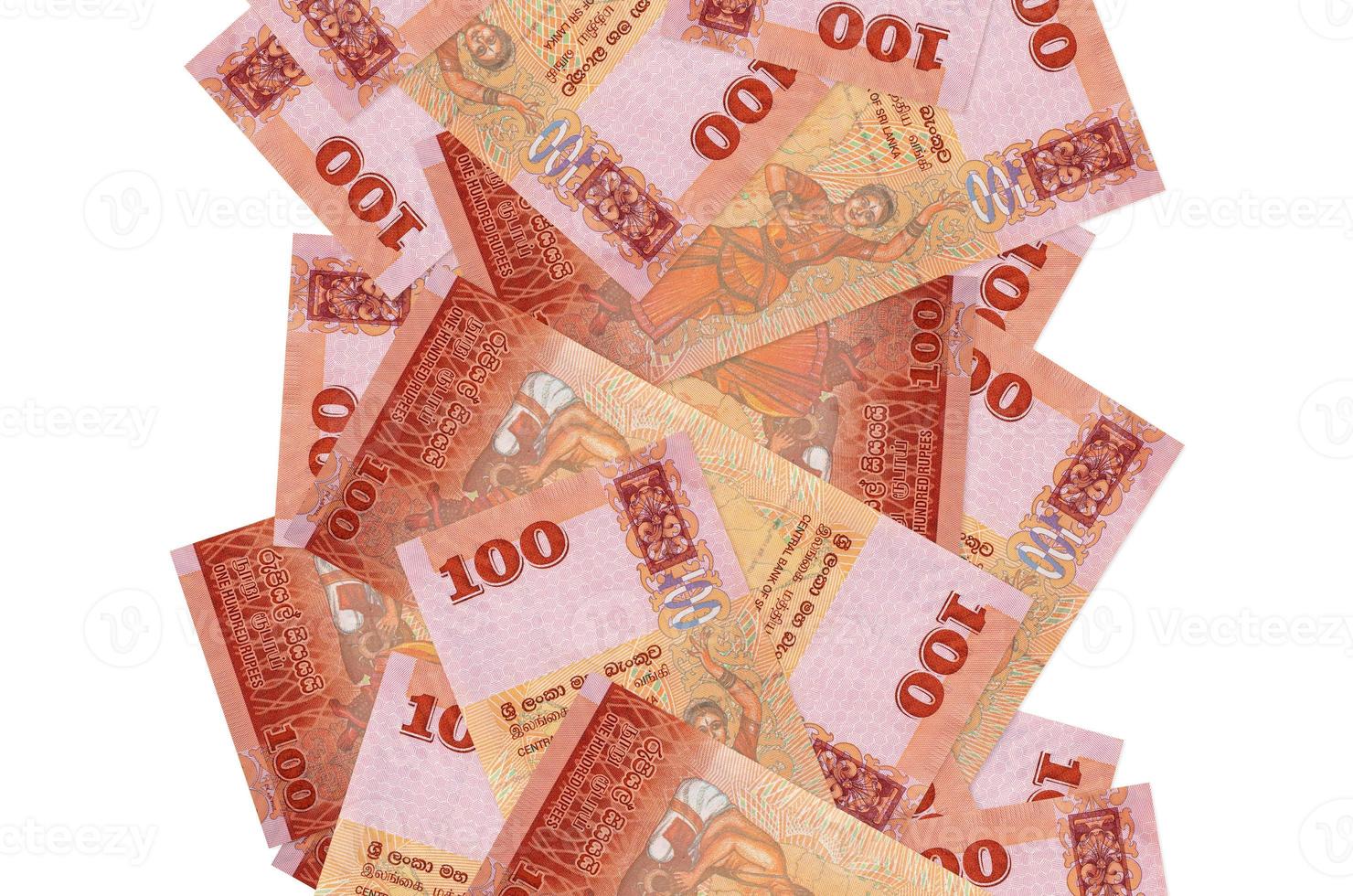100 Sri Lankan rupees bills flying down isolated on white. Many banknotes falling with white copyspace on left and right side photo