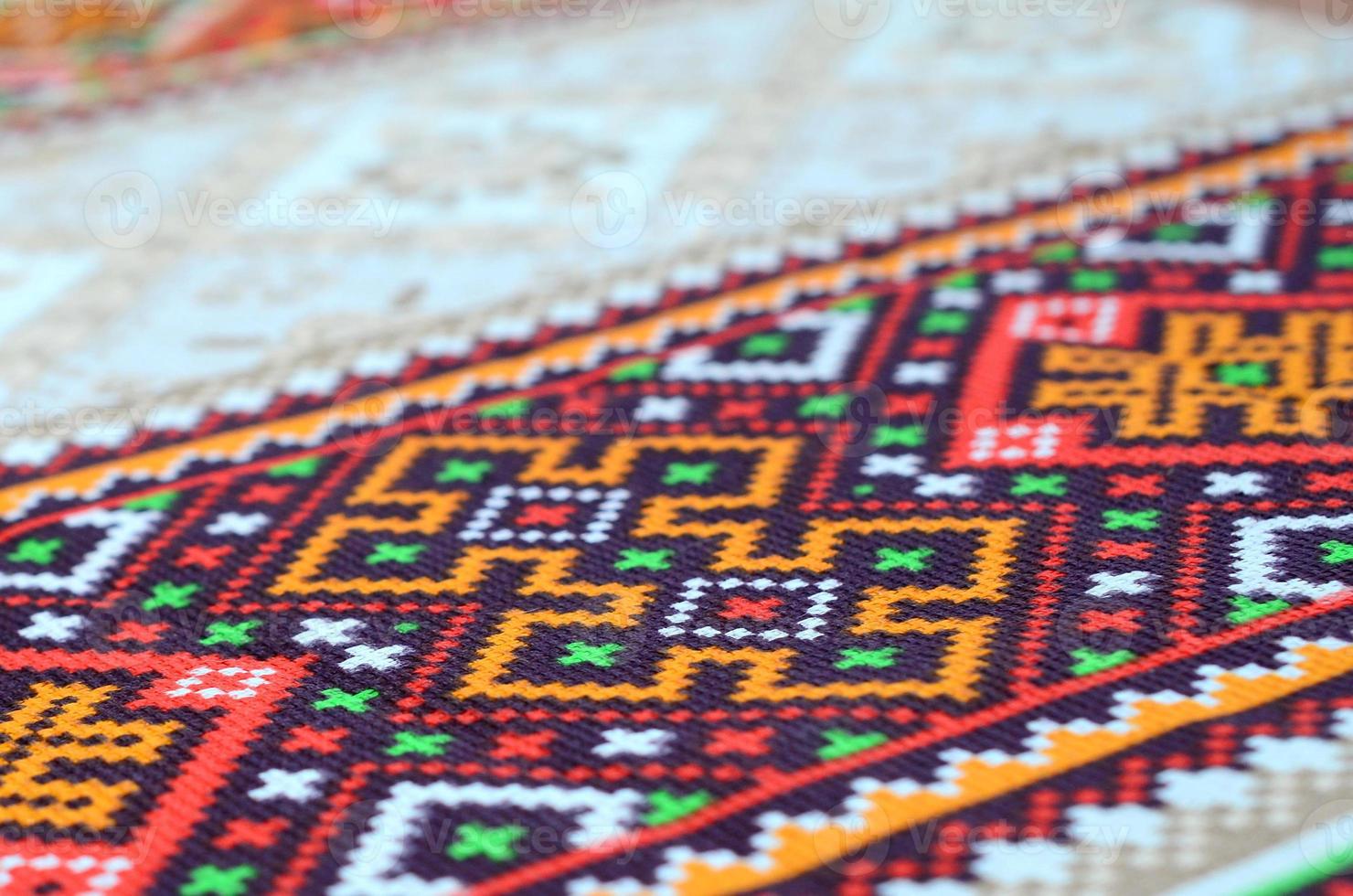 Traditional Ukrainian folk art knitted embroidery pattern on textile fabric photo