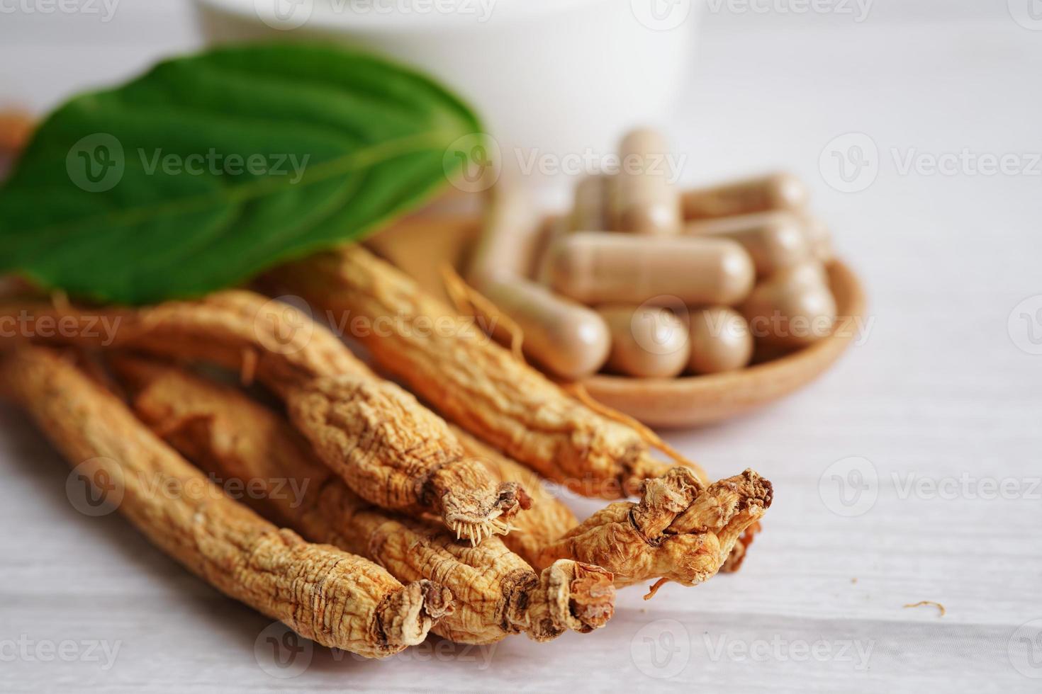 Ginseng roots and green leaf, healthy food. photo