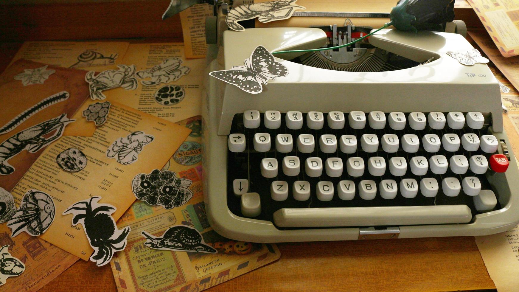 Vintage Desk Top Setting With Old Books And Typewriter photo