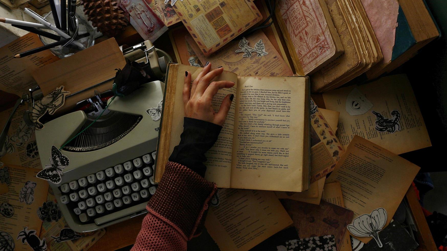 Vintage Desk Top Setting With Old Books And Typewriter photo