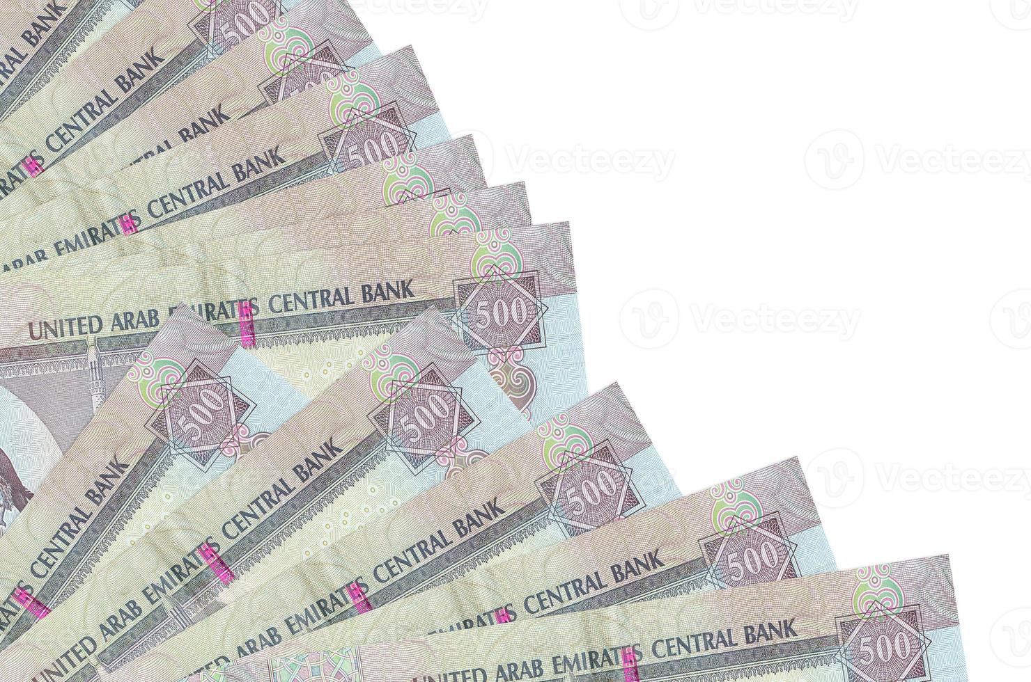 500 UAE dirhams bills lies isolated on white background with copy space stacked in fan close up photo