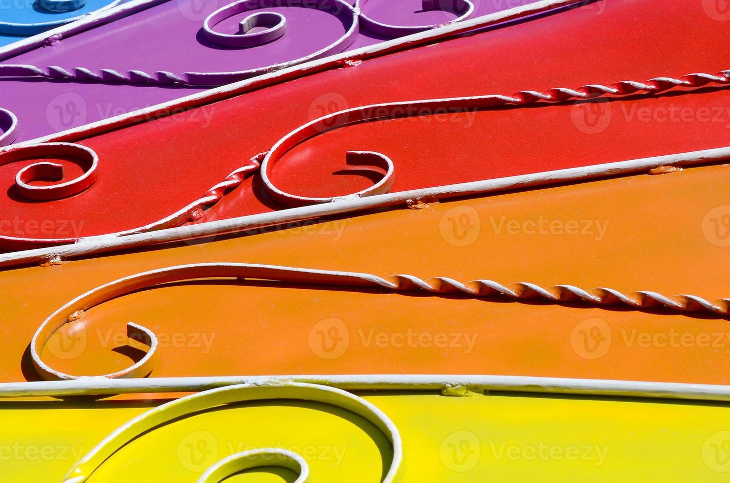 Metal texture of a piece of colored wall with a forged pattern photo