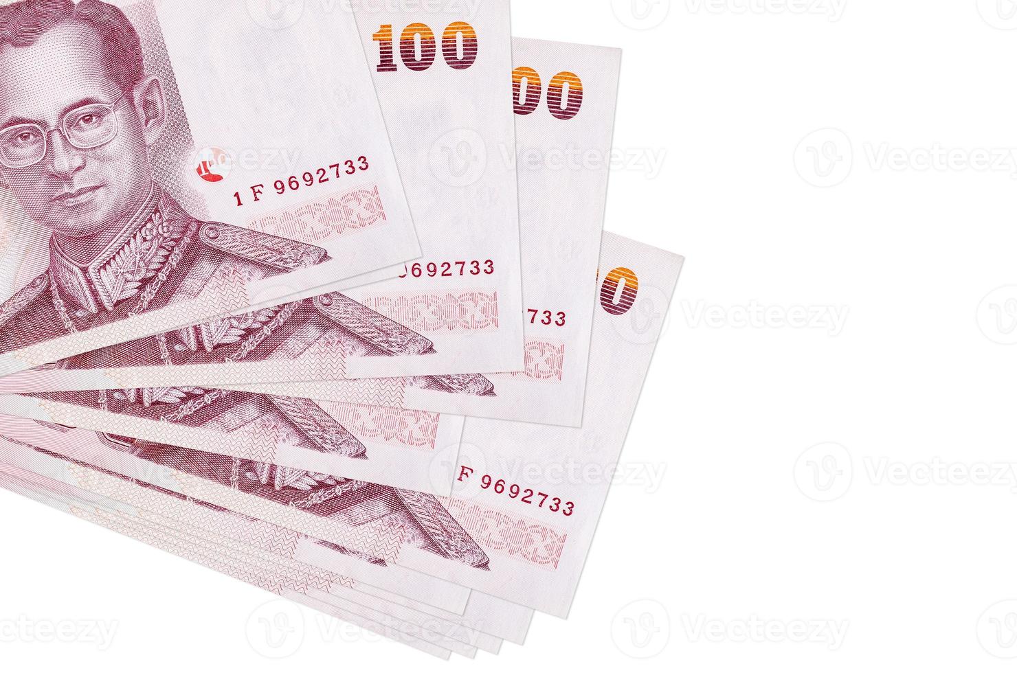 100 Thai Baht bills lies in small bunch or pack isolated on white. Mockup with copy space. Business and currency exchange photo