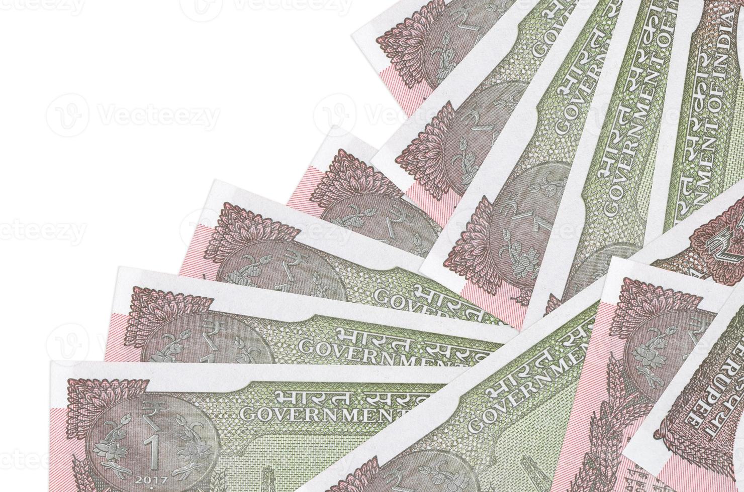 1 Indian rupee bills lies in different order isolated on white. Local banking or money making concept photo