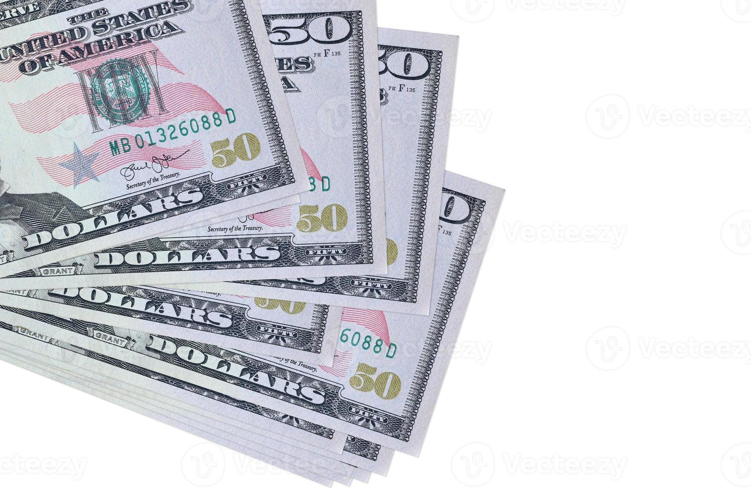 50 US dollars bills lies in small bunch or pack isolated on white. Mockup with copy space. Business and currency exchange photo