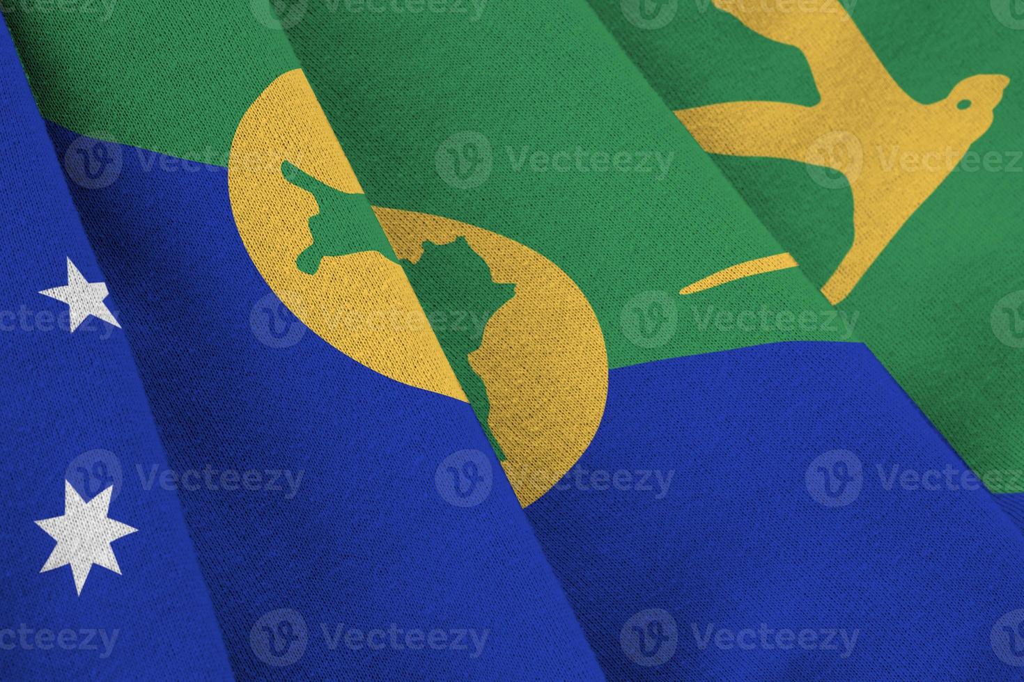 Christmas island flag with big folds waving close up under the studio light indoors. The official symbols and colors in banner photo