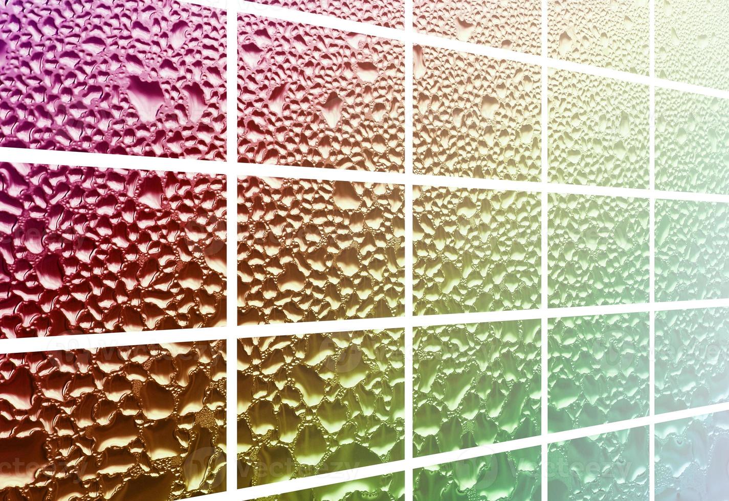 A collage of many different fragments of glass, decorated with rain drops from the condensate. Rainbow colors photo