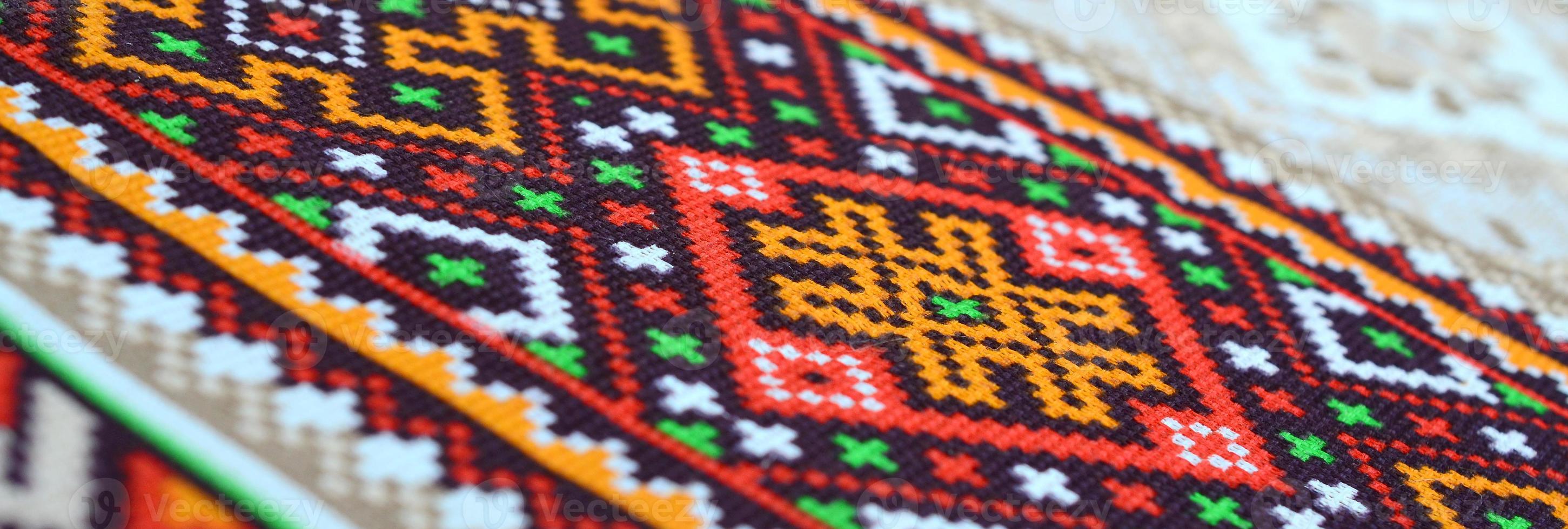 Traditional Ukrainian folk art knitted embroidery pattern on textile fabric photo