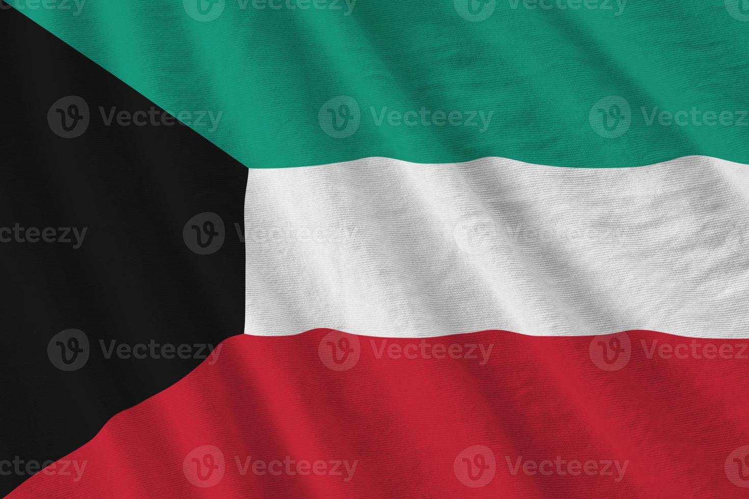 Kuwait flag with big folds waving close up under the studio light indoors. The official symbols and colors in banner photo