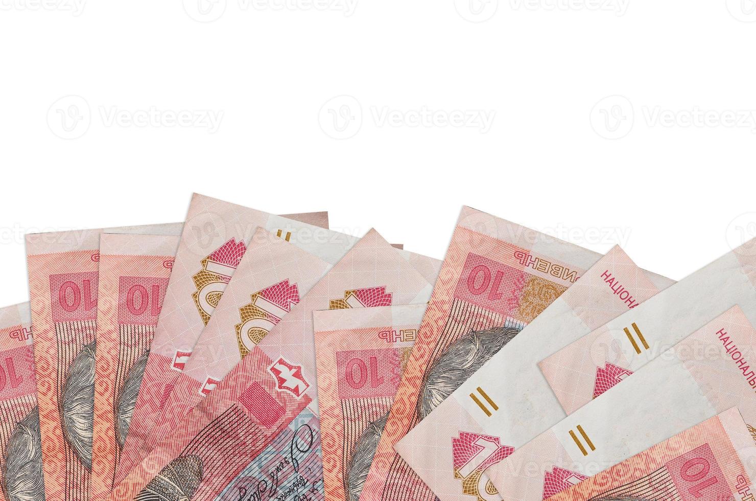 10 Ukrainian hryvnias bills lies on bottom side of screen isolated on white background with copy space. Background banner template photo