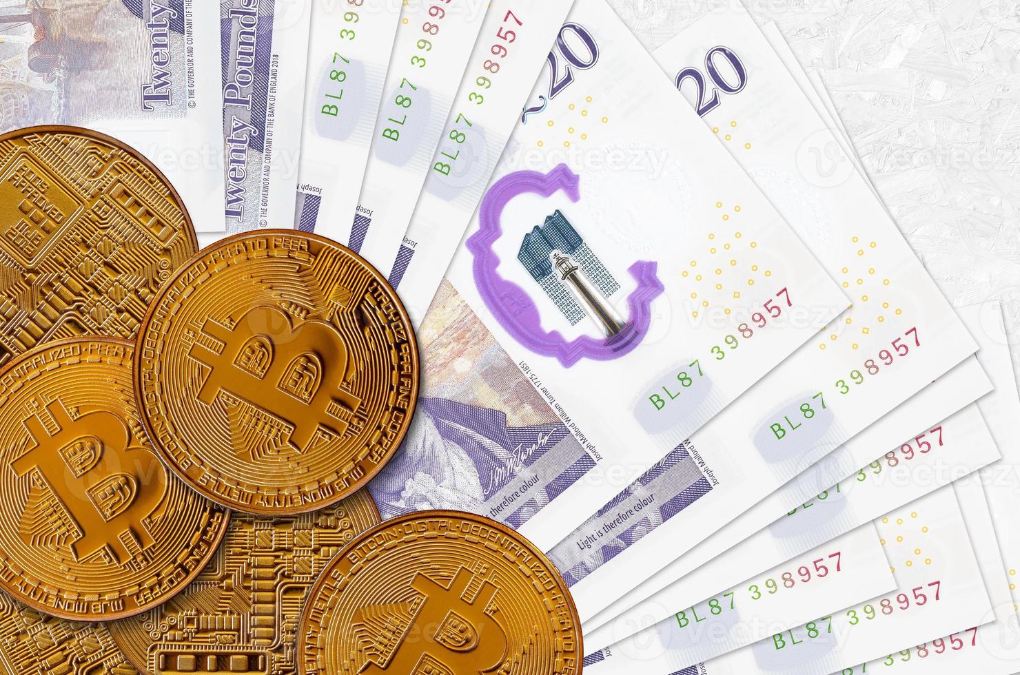 20 British pounds bills and golden bitcoins. Cryptocurrency investment concept. Crypto mining or trading photo