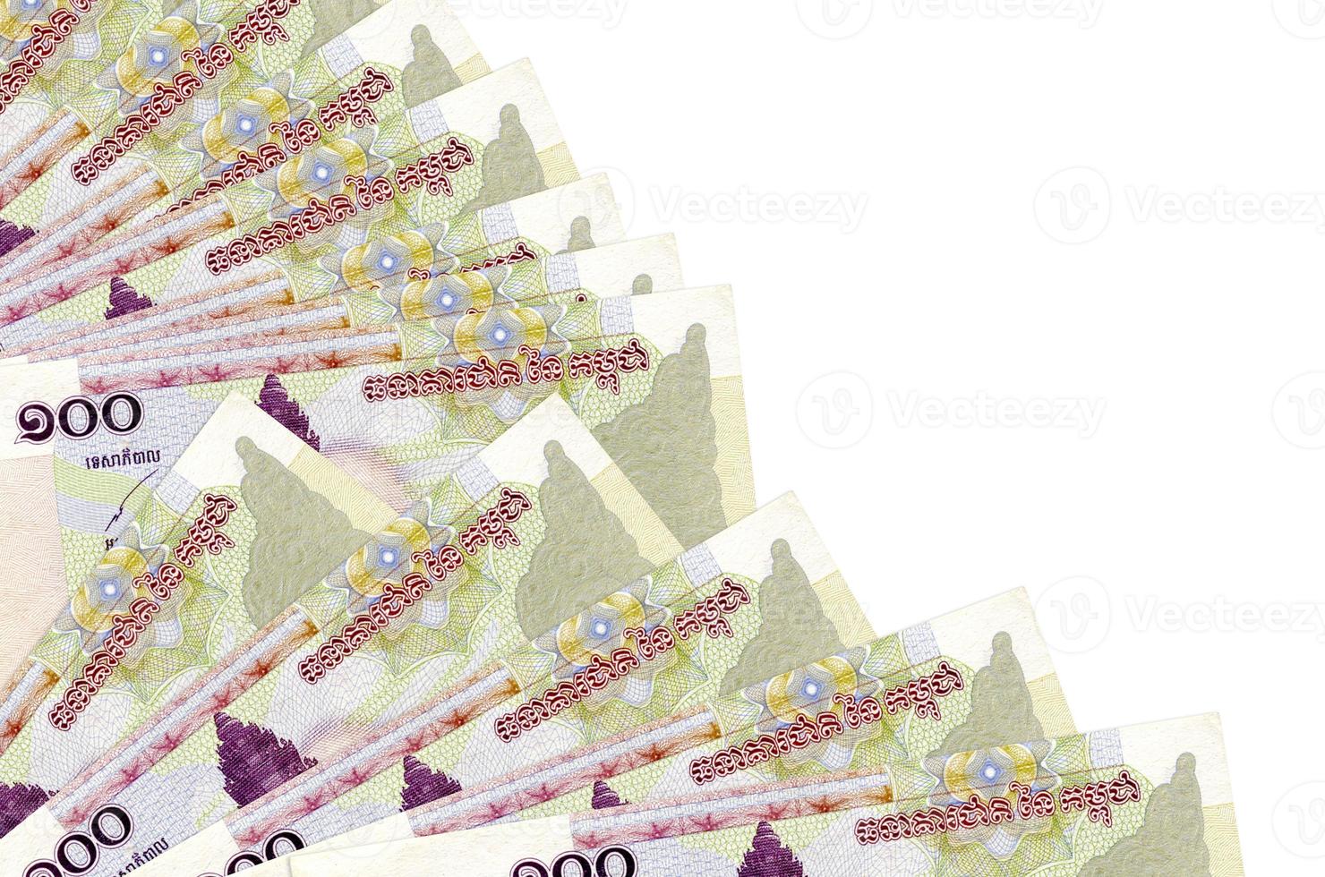 100 Cambodian riels bills lies isolated on white background with copy space stacked in fan close up photo