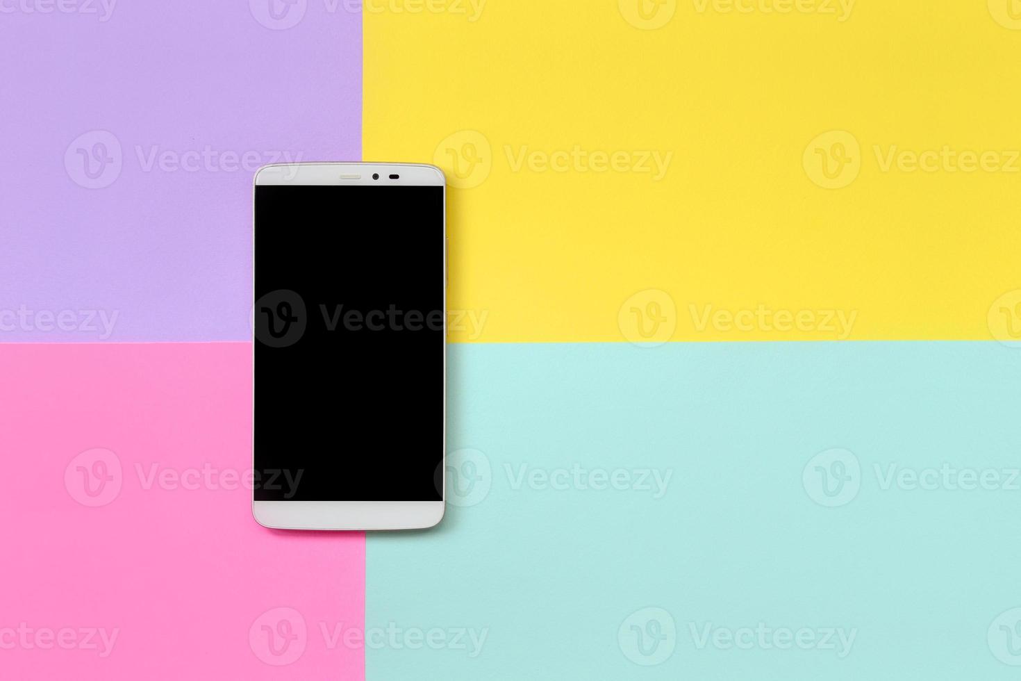 Modern smartphone with black screen on texture background of fashion pastel blue, yellow, violet and pink colors paper in minimal concept photo