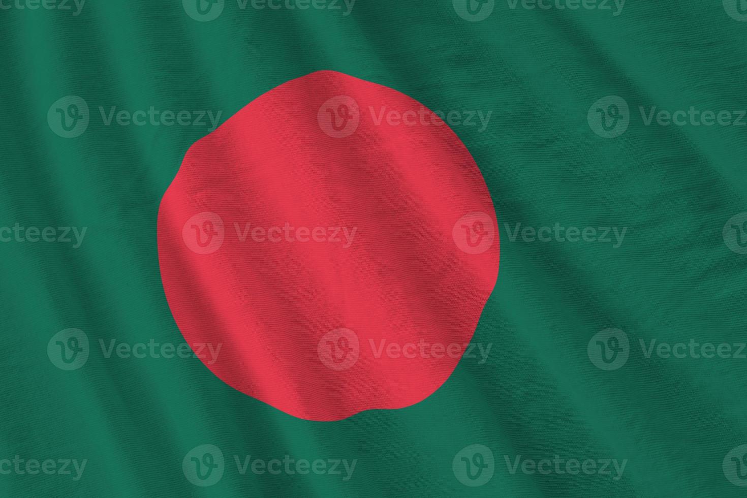 Bangladesh flag with big folds waving close up under the studio light indoors. The official symbols and colors in banner photo