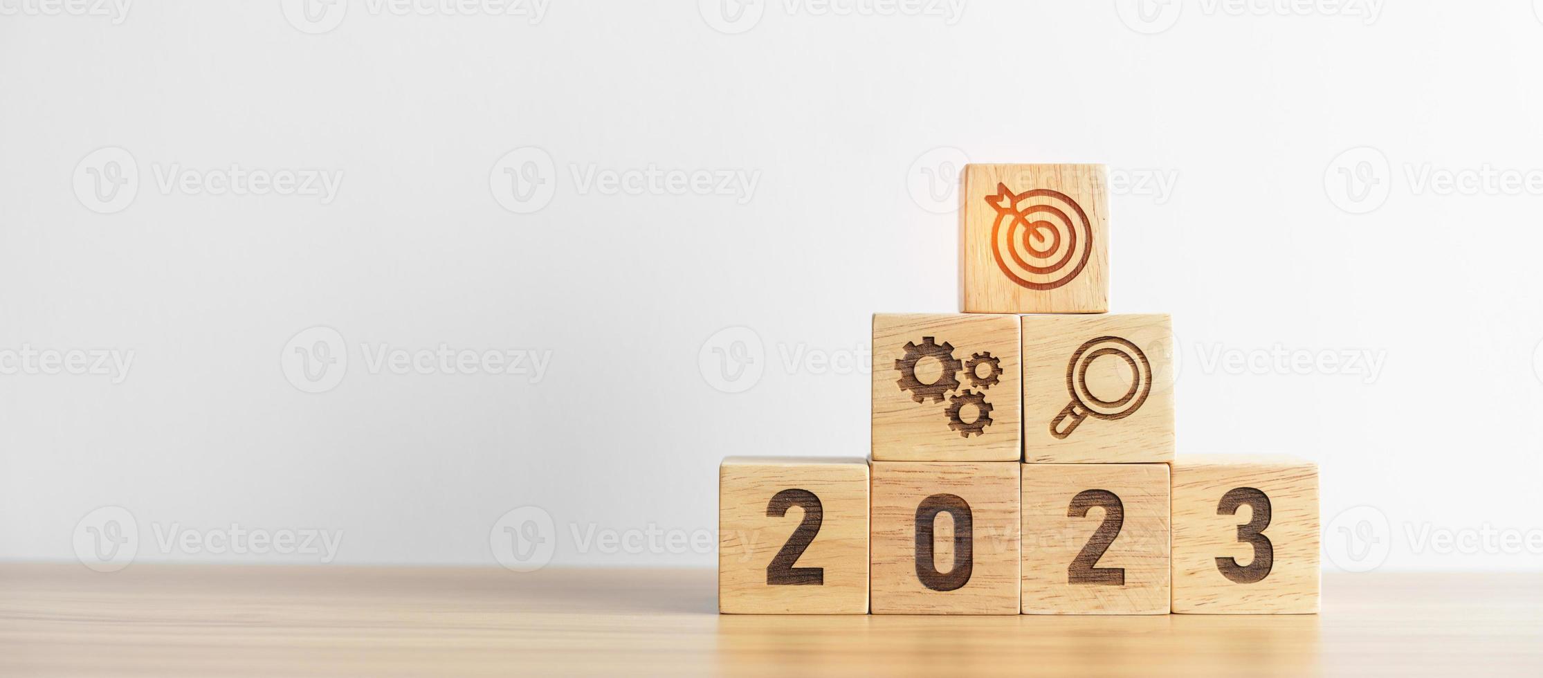 2023 wood block with business goal, plan. Action strategy, target, mission, teamwork, idea and New Year start concept photo