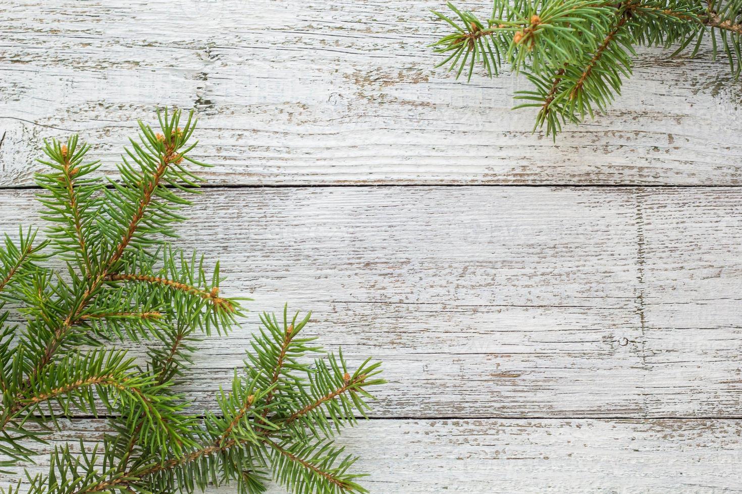 Christmas wooden background with fir tree. Top view copy space photo