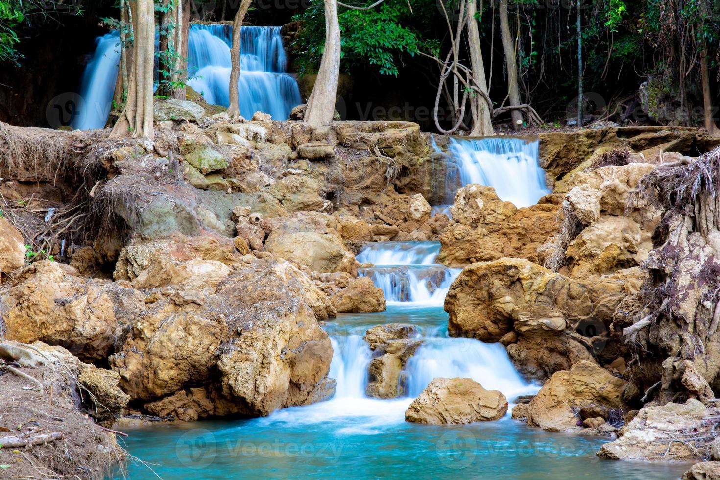 Amazing colorful waterfall in national park forest during spring,beautiful deep forest in Thailand,technic long exposure, during vacation and relax time. photo