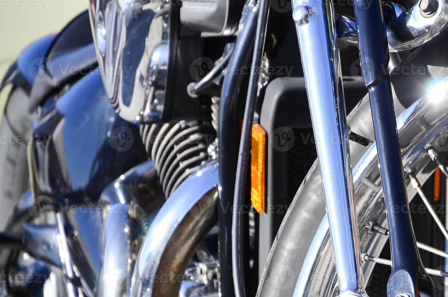 Fragment of chromed shiny wheel of old classic motorbike photo