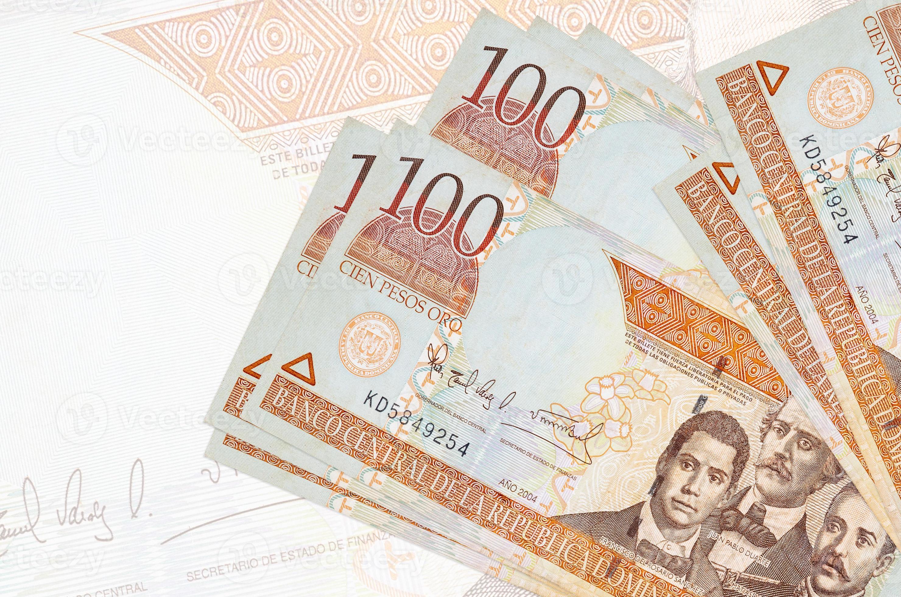 100 Dominican Peso Bills Lies In Stack On Background Of Big Semi 