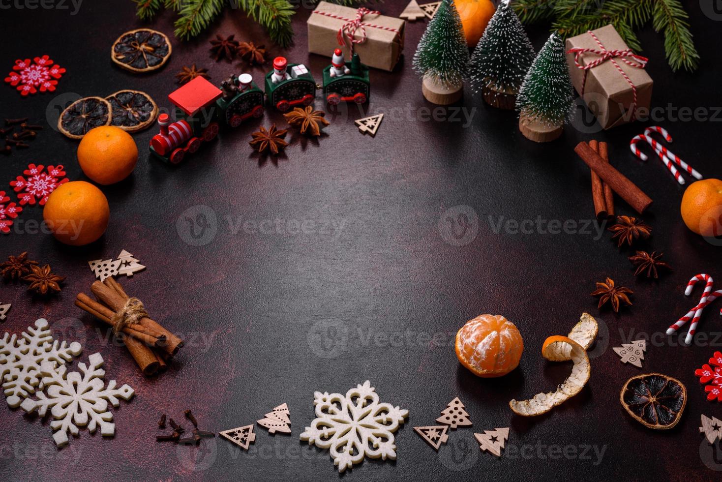 Christmas pie stollen with marzipan, berries and nuts on a dark concrete background photo