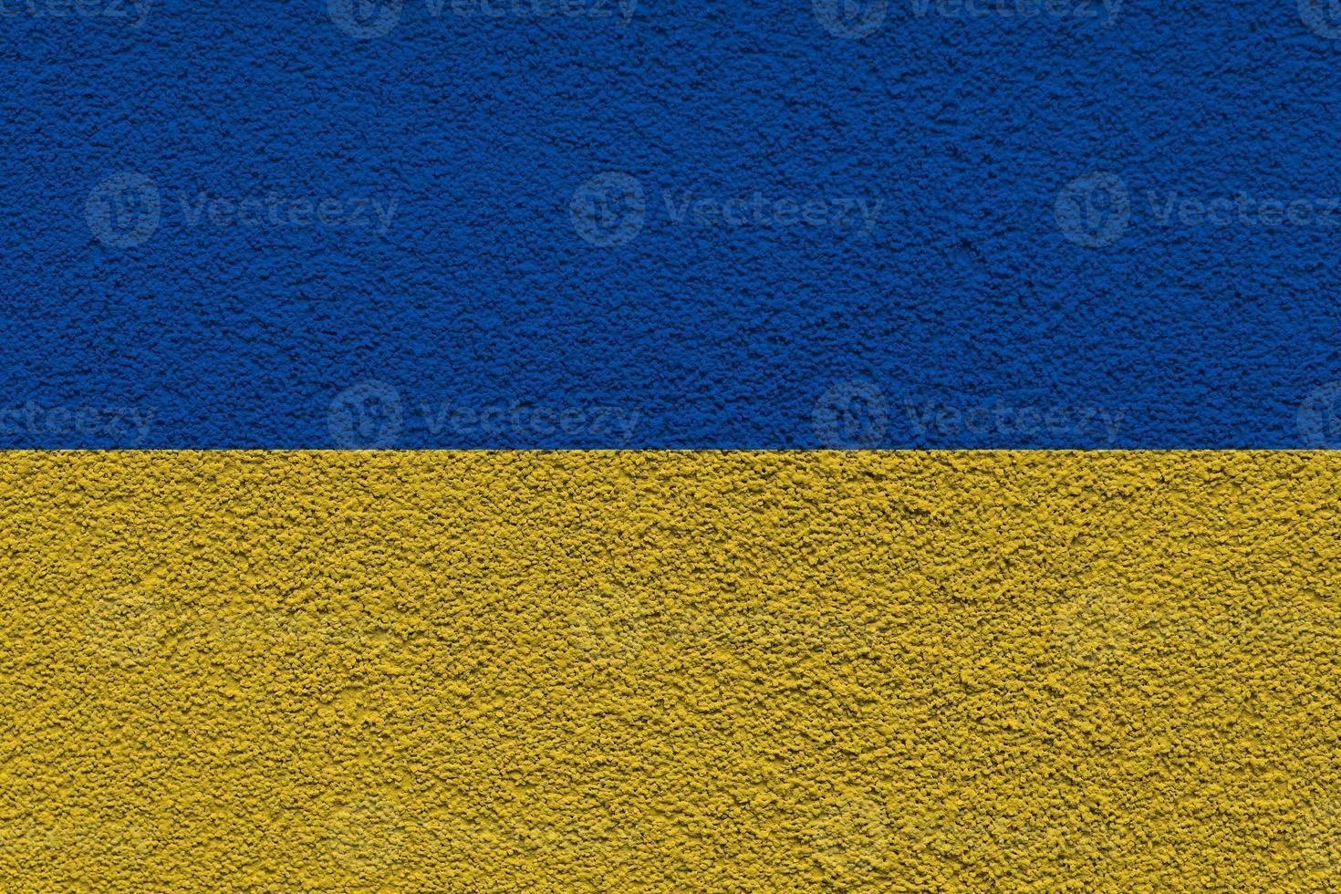 Ukrainian state national flag. Texture concrete grunge wall in yellow-blue color. State symbol of Ukraine and Ukrainians. Ukrainian flag on a concrete wall background. photo