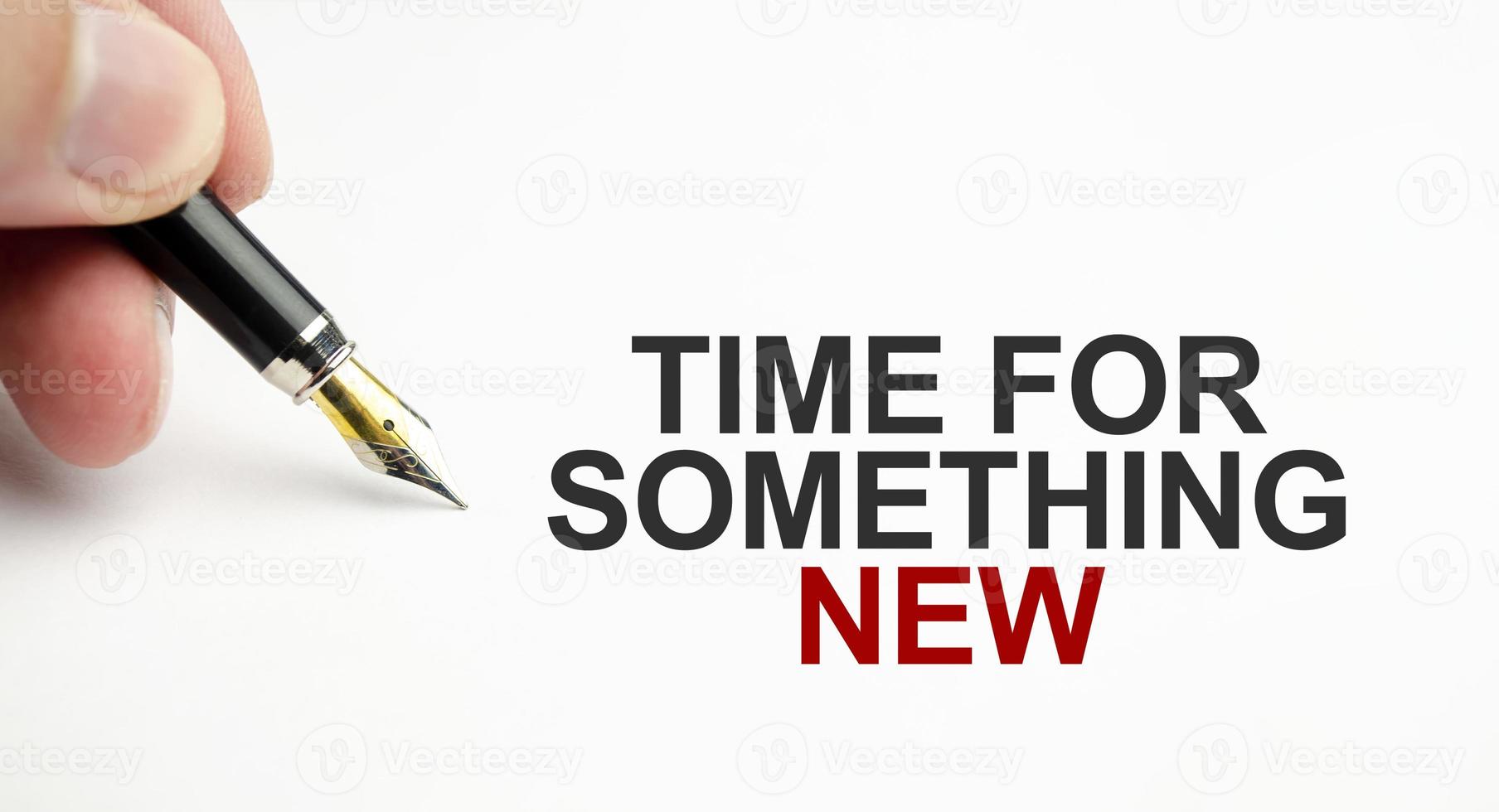 Time to something new - written on white paper with pen photo