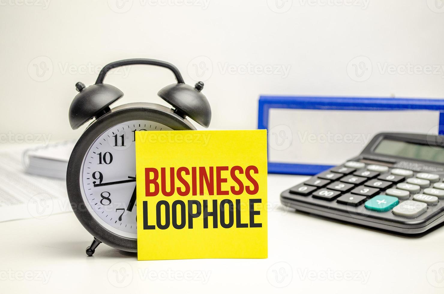 business loophole words on paper with tax forms photo