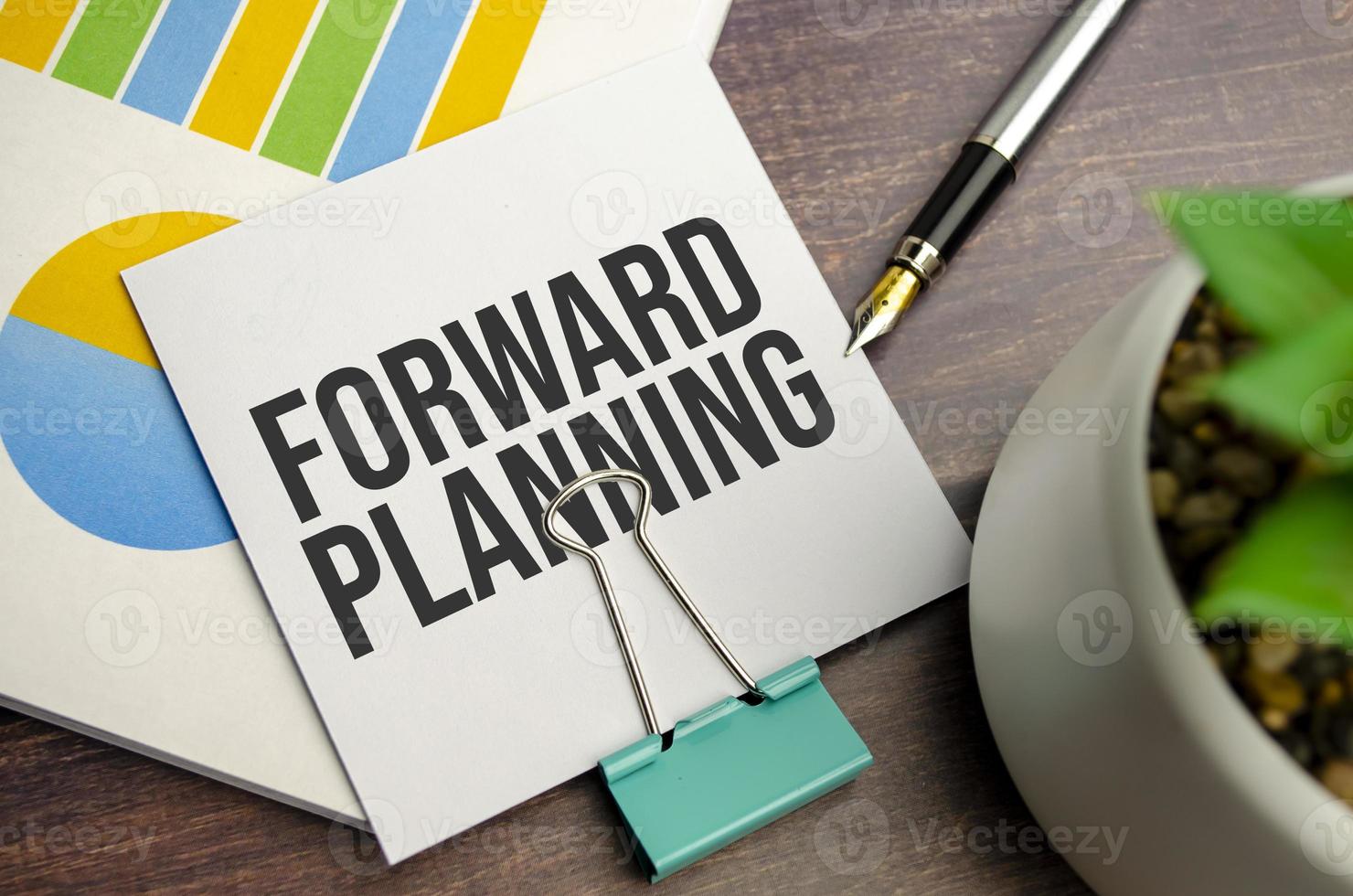 white sticker and charts and forward planning words photo