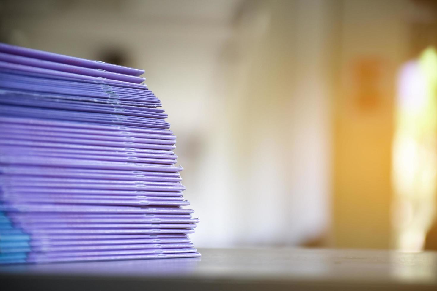 Used paper of various sizes is bundled together to sell or make recycled paper on the front porch of an office, soft focus, sunlight edited, environmental frineds concept. photo