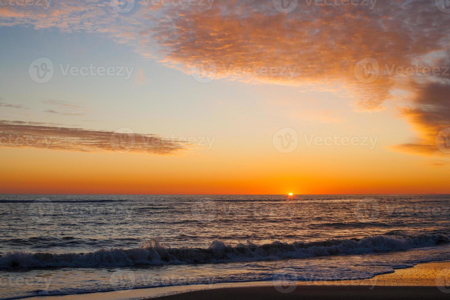 sunset on the sea beautiful waves photo