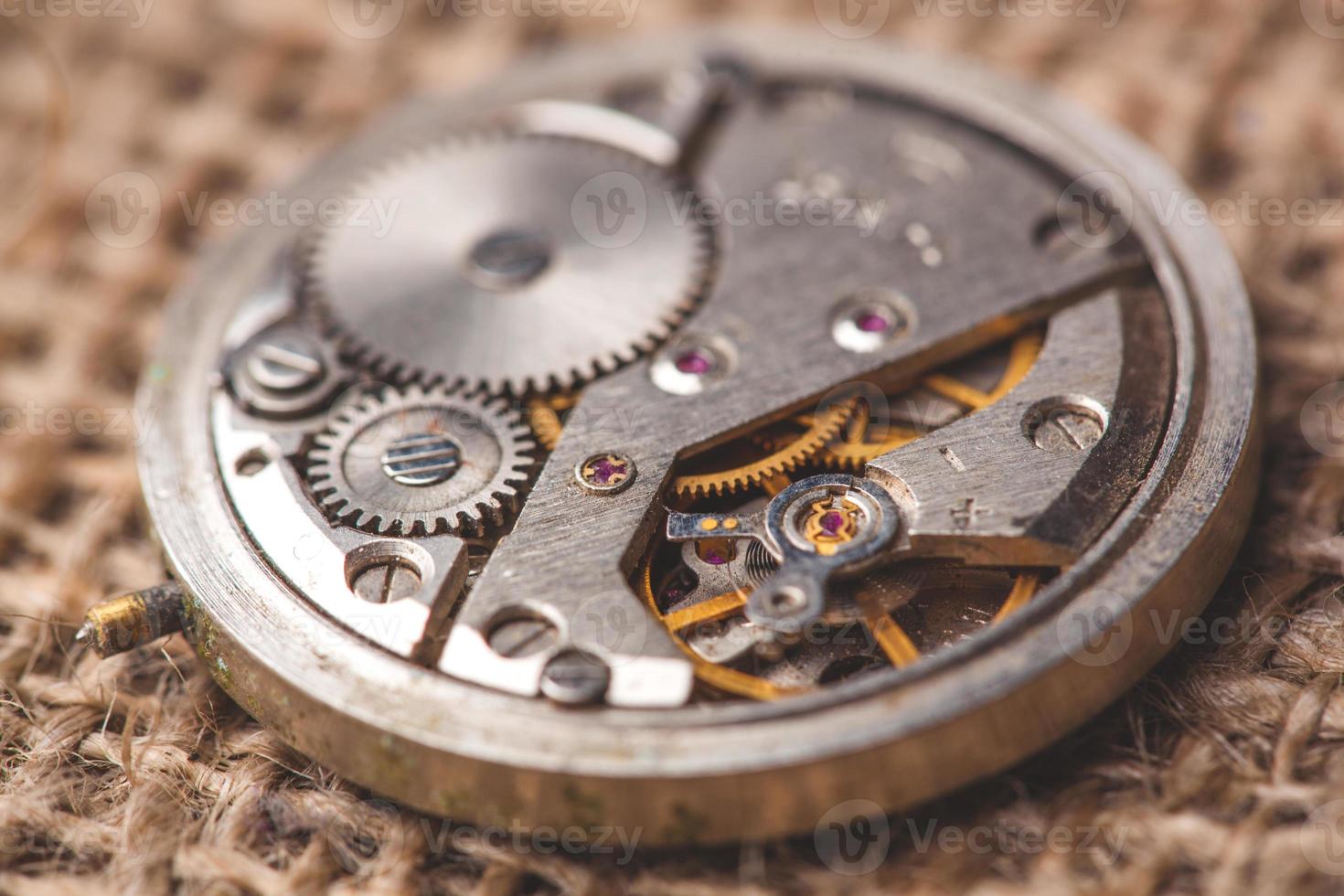 Clockwork old mechanical watch. close up, macro shot photo