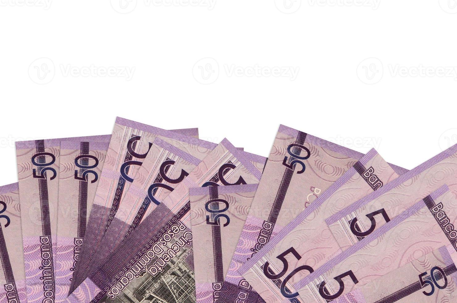 50 Dominican pesos bills lies on bottom side of screen isolated on white background with copy space. Background banner template photo