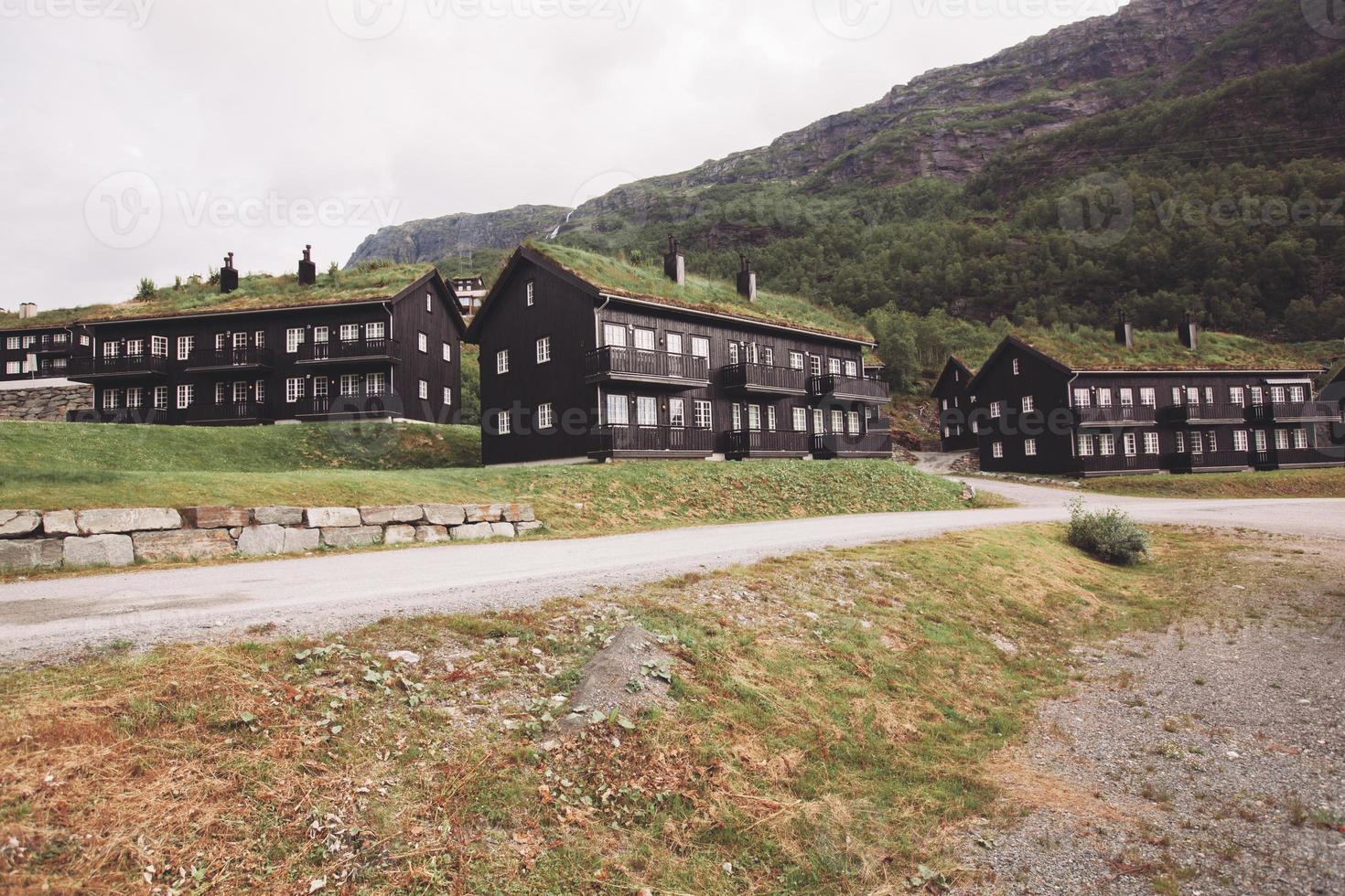 Norway, traditional houses in the mountains with grass on the roof. photo